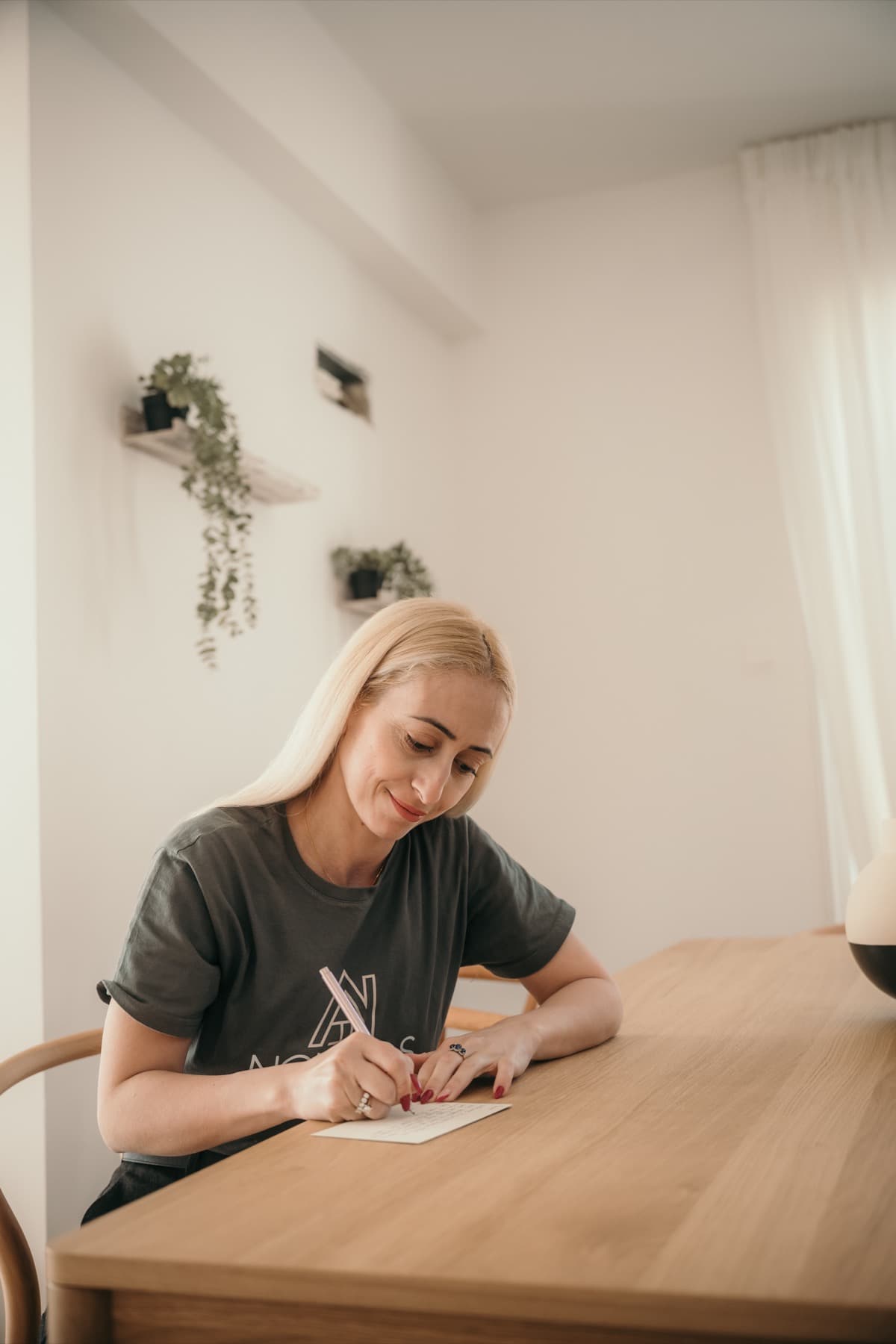 Nomads Properties team member writing a personalised welcome note